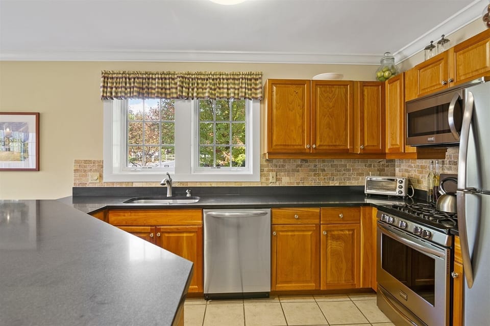 Open Kitchen with Stainless Steel Appliances