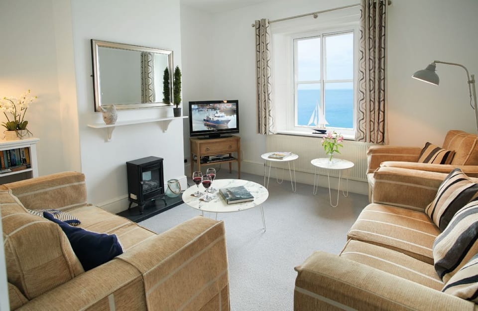Ground floor: Sitting room with sea views (please note, there is now a new sofa)