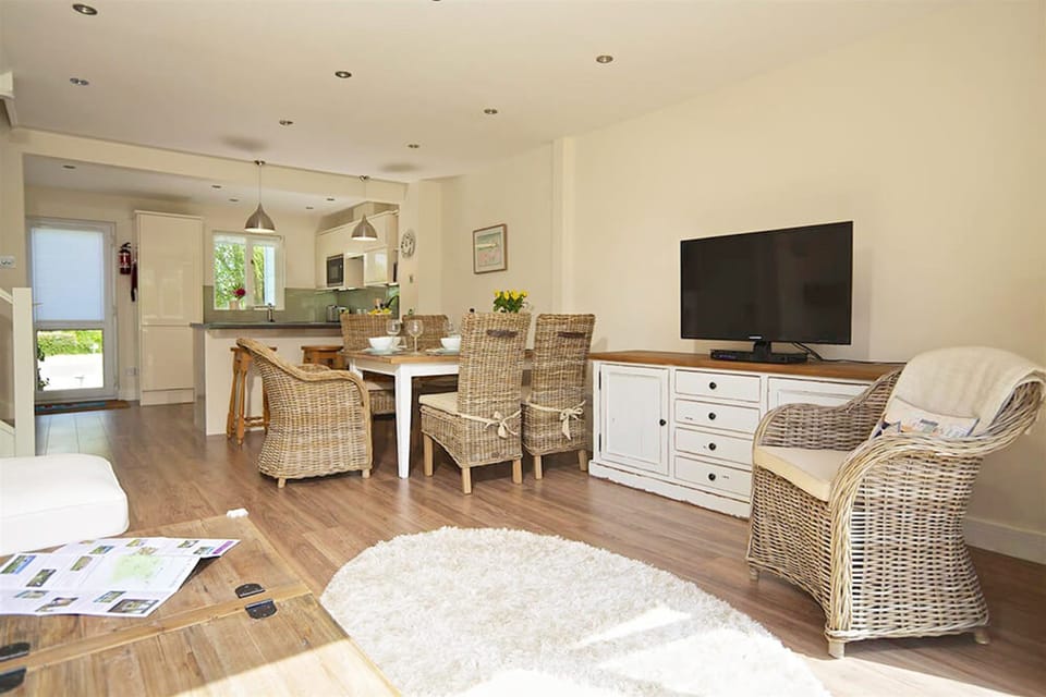 Ground floor: Open plan living space with sitting and dining areas seating six