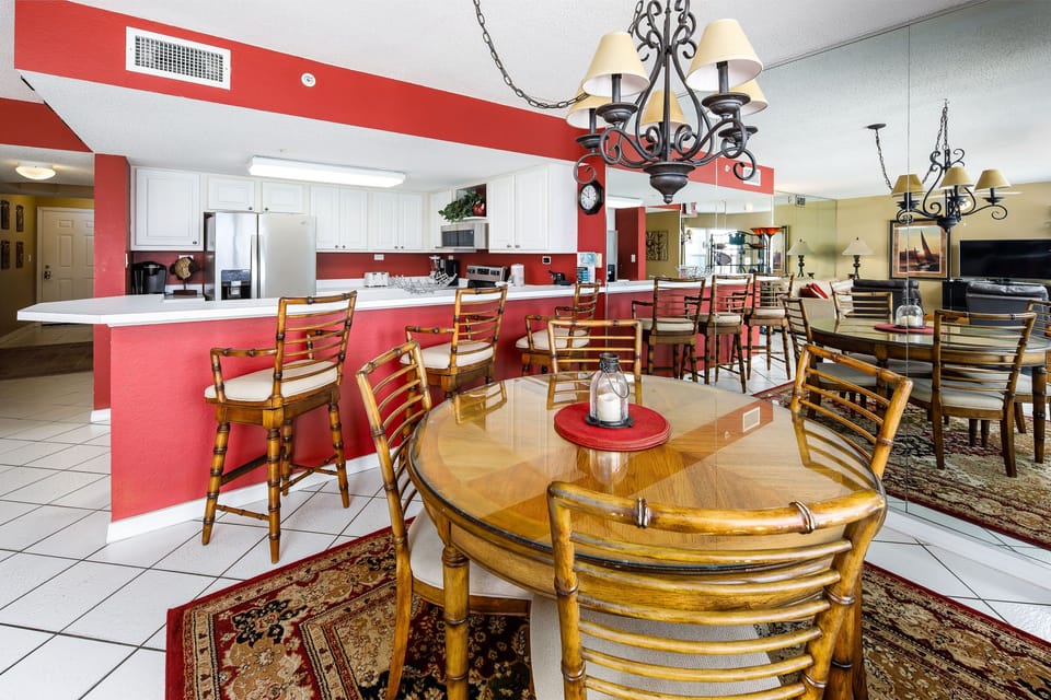 Dining Area - The dining room table seats 4 but there are more seats available at the breakfast bar