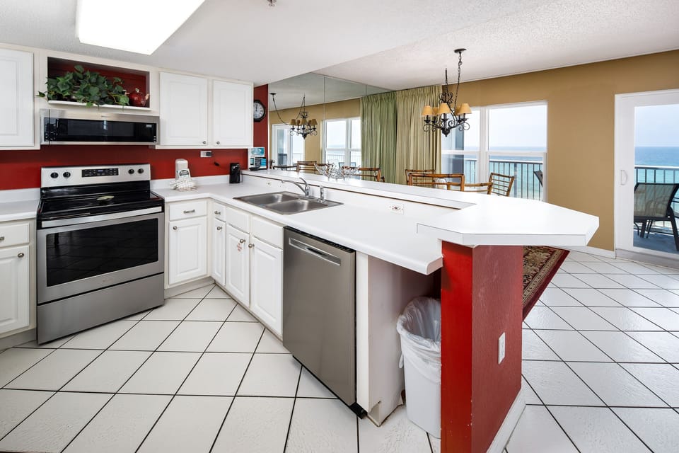 Kitchen - Fully stocked kitchen features all stainless steel appliances.