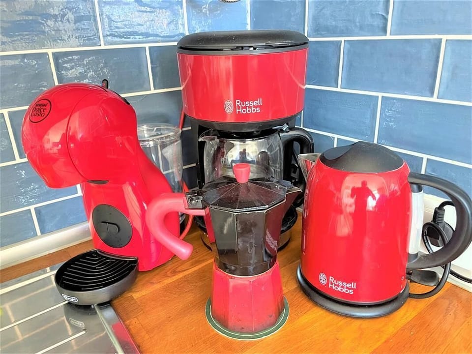 Set of coffee machine and kettle available for guests