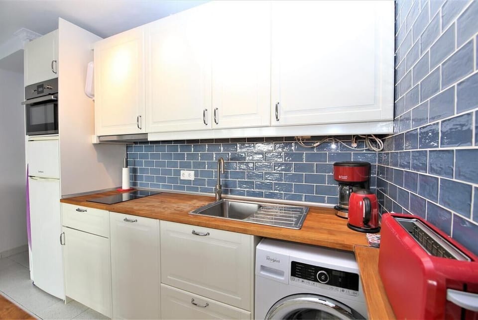 View of the fully equipped kitchen from another angle