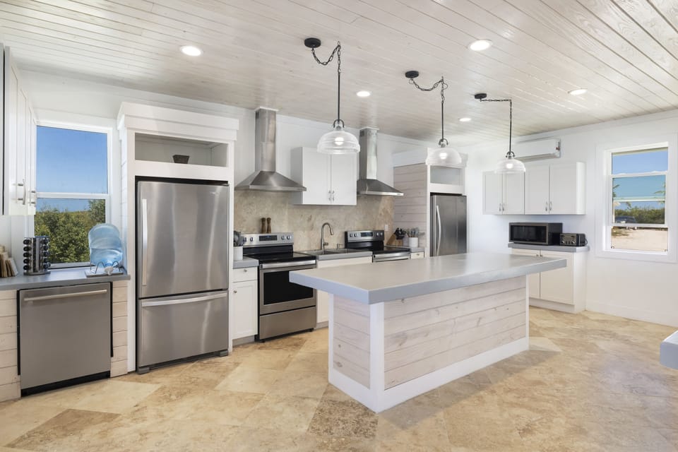Main Lodge kitchen, fully equipped with two refrigerators, two ranges, and two ovens.