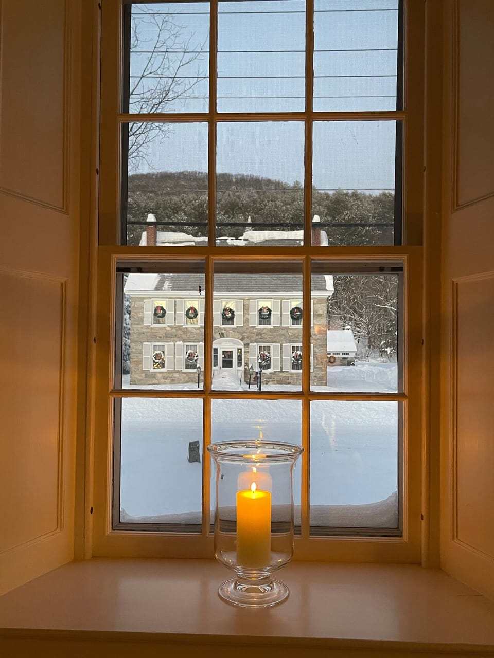 Winter view of stone house across the street