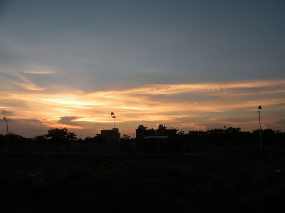 Home at the outskirts of Jodhpur along with small family car. House in Rajasthan