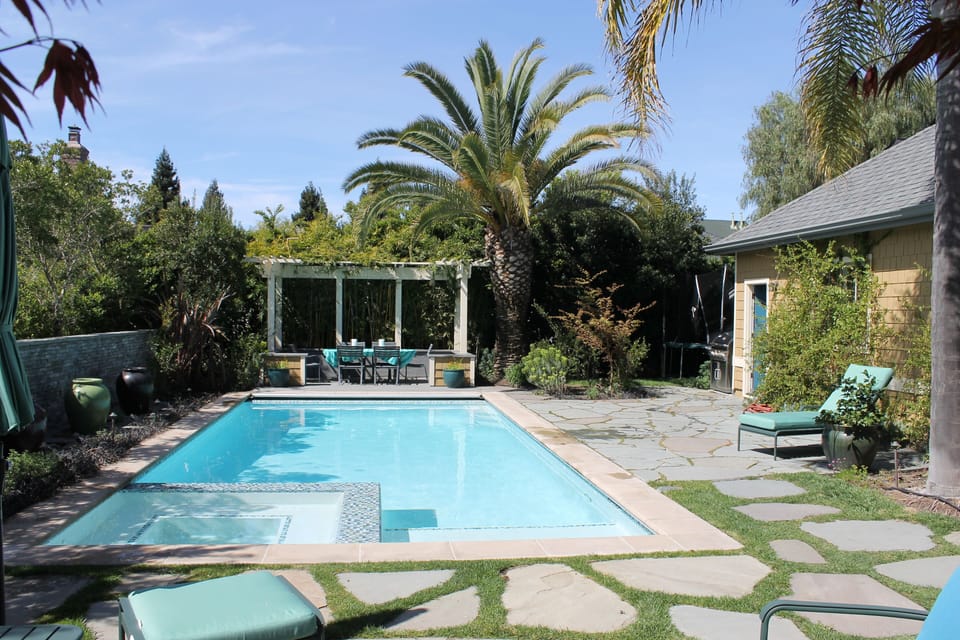 Pool And Spa With Six Burner Weber Grill and Fire Pit
