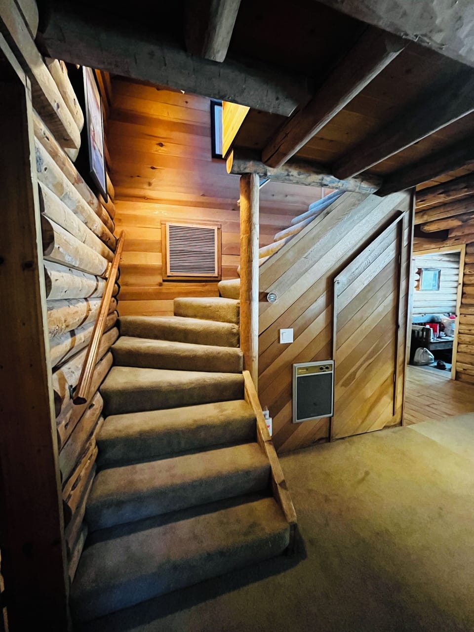 Stairs to upstairs bedrooms and bathroom