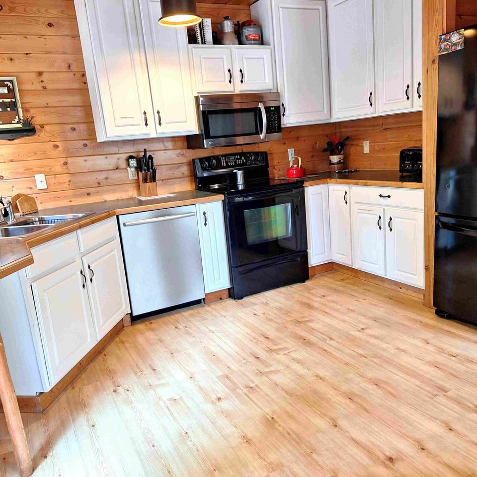 Fully equipped kitchen (BBQ charcoal grills just off deck)