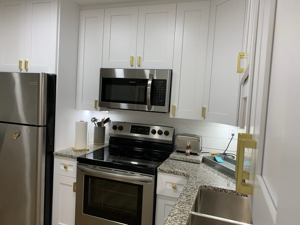 Kitchen with Cookware and Dishes 