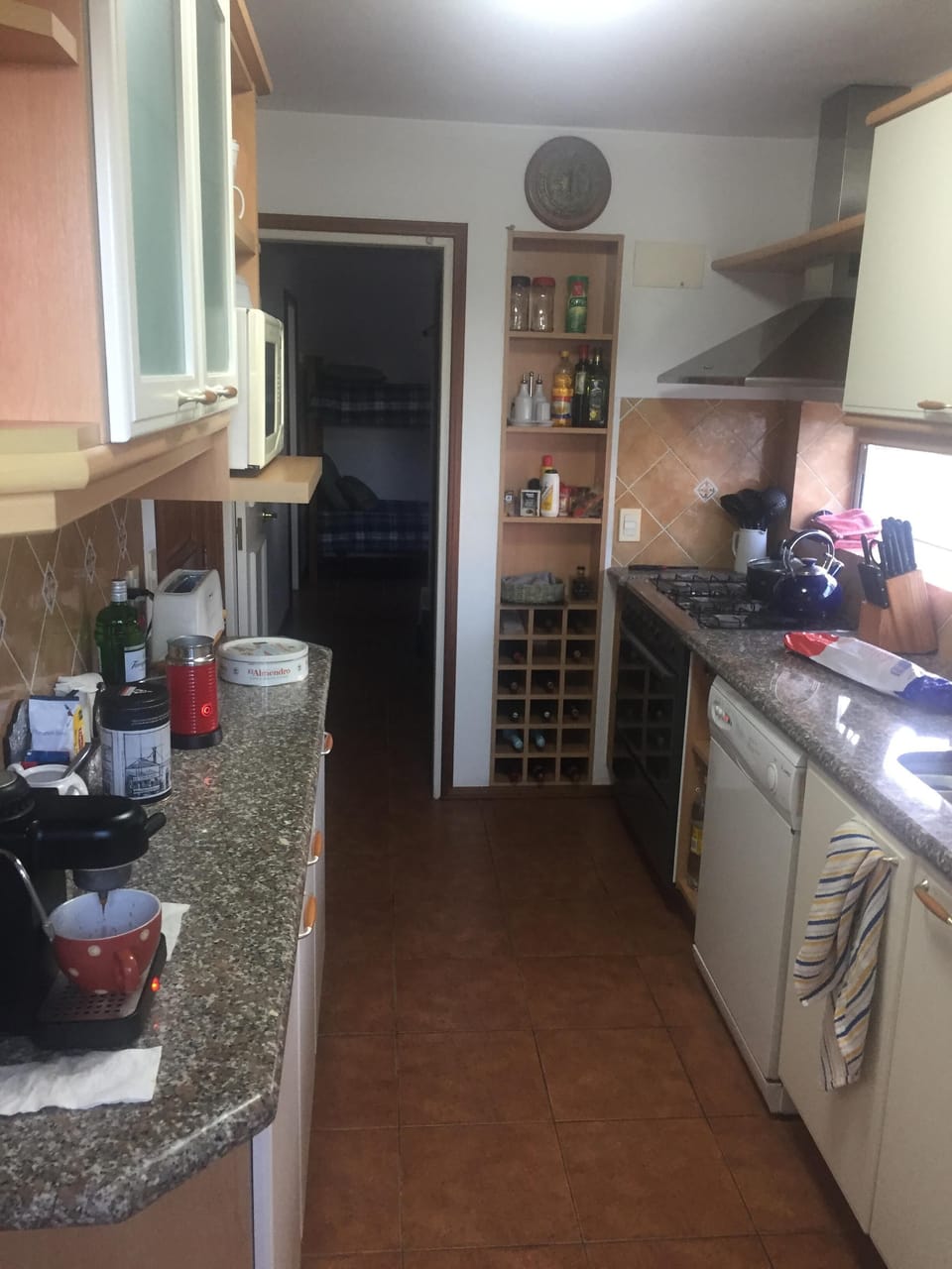 Kitchen w/passage to maid's room/back bunk beds and washer/dryer.