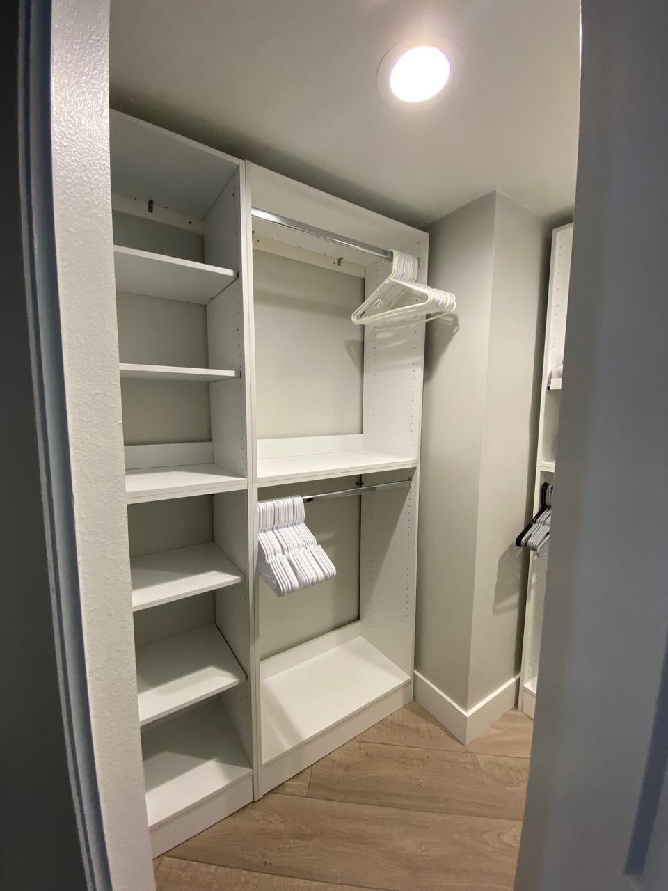 Primary bedroom walk-in closet