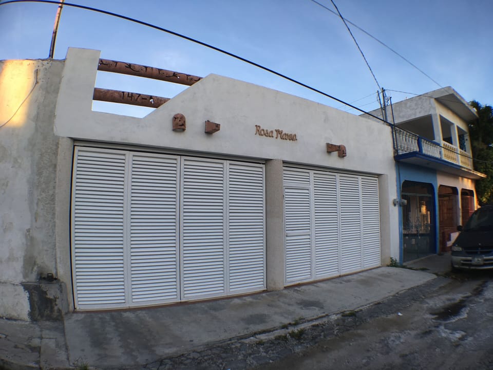 front of house with garage stalls closed and locked