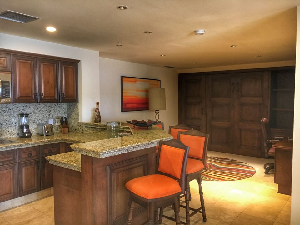 Spacious kitchen with Murphy bed in distance