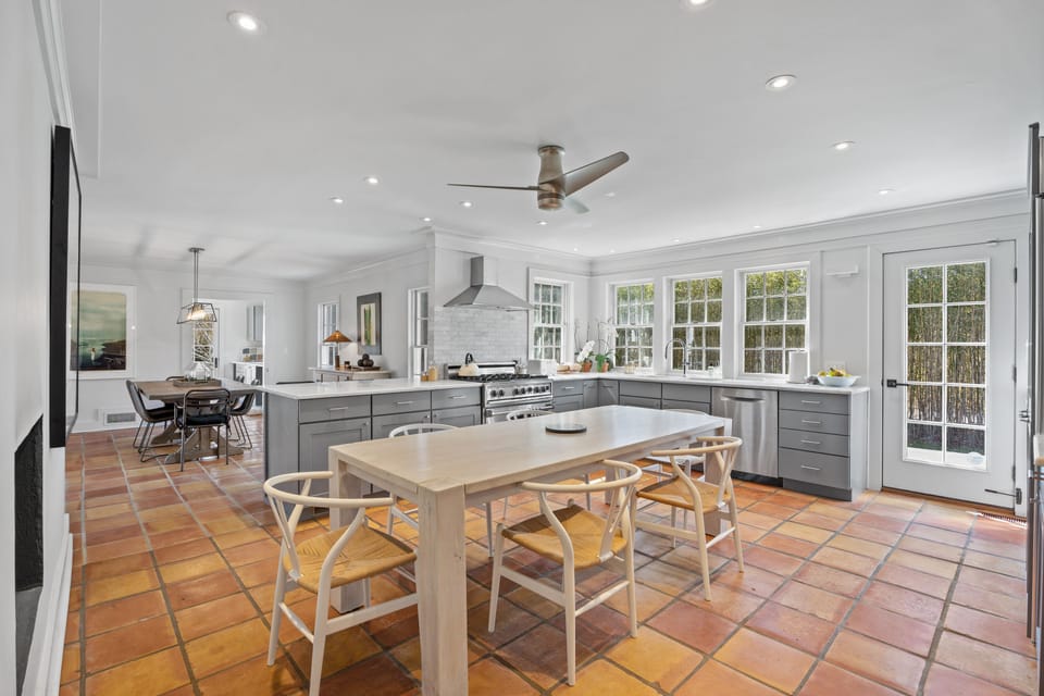 Gourmet, eat-in kitchen with access to stone patio & bbq