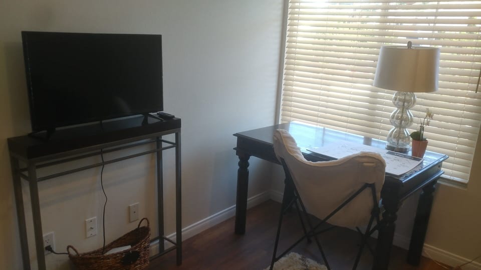 Upper level office with pull out queen bed and flat screen TV.