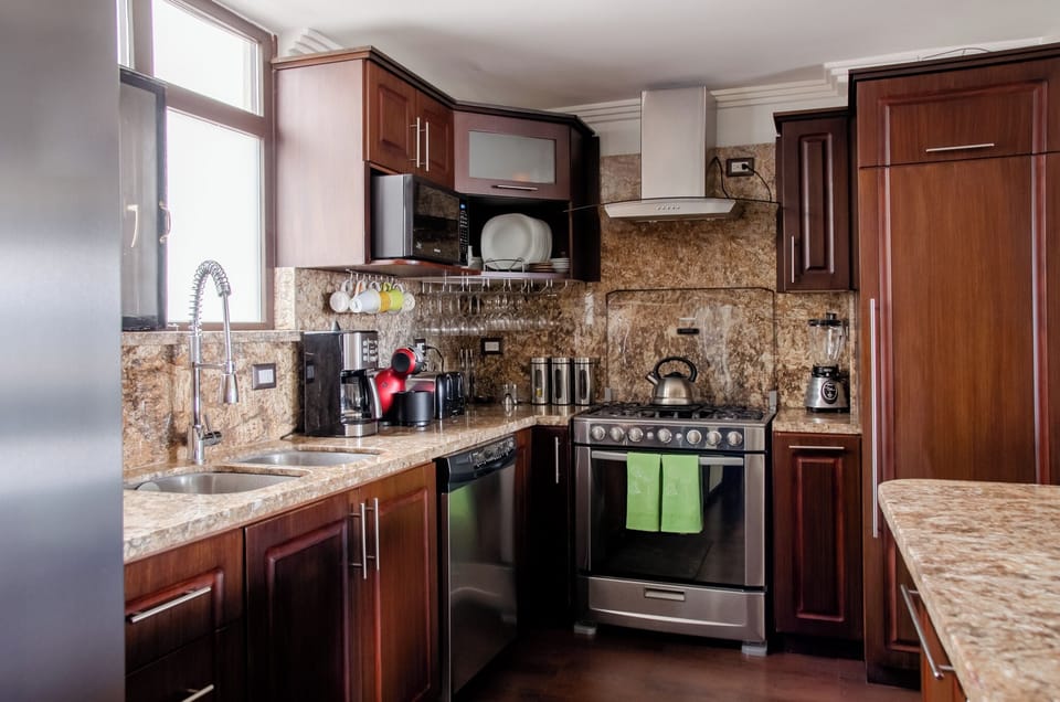 Enjoy a dishwasher, 6-burner stove, oven, microwave, filtered icemaker, & more!