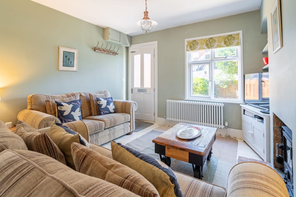 Number 22, Aldeburgh: Bright sitting area with wood burning stove
