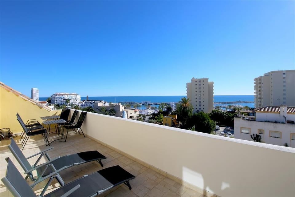 Second terrace on the upper floor with stunning views and extra seating and loungers