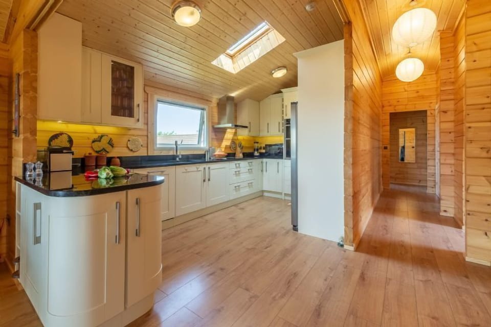 Ground floor: The kitchen is fully equipped with an electric oven and hob, combi microwave/oven/grill, fridge/freezer and dishwasher