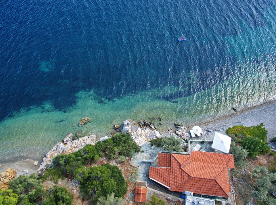 Aerial shot of the villa and beach below , secluded and private ,not overlooked 