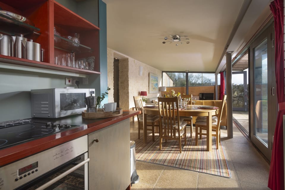 The kitchen leading into the open-plan living area
