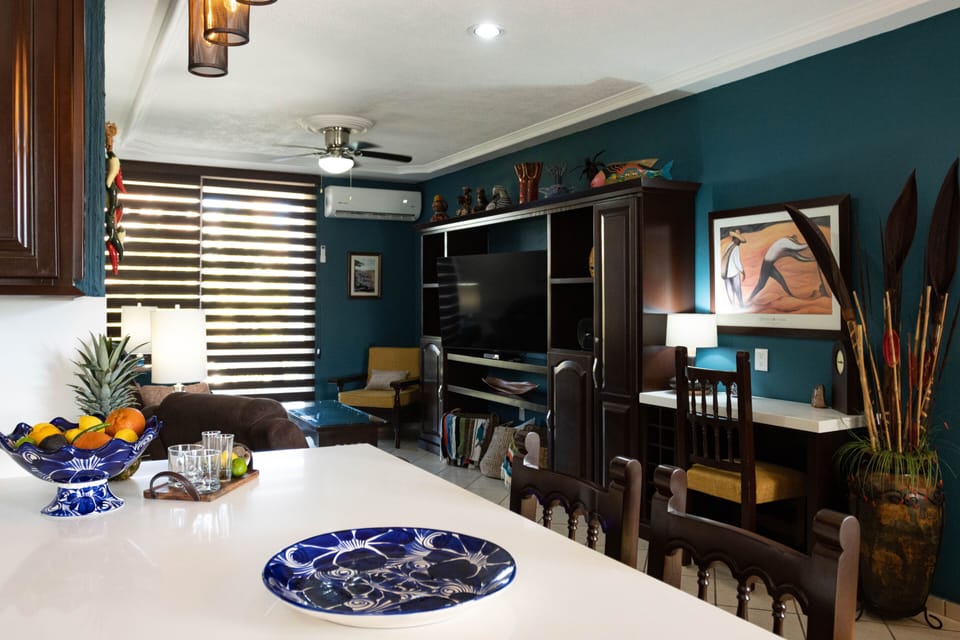 Living area includes a desk/work area, new A/C unit, Smart TV