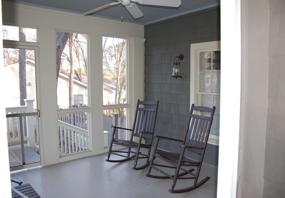 Front screened porch with ceiling fan - perfect for cocktails or iced tea!