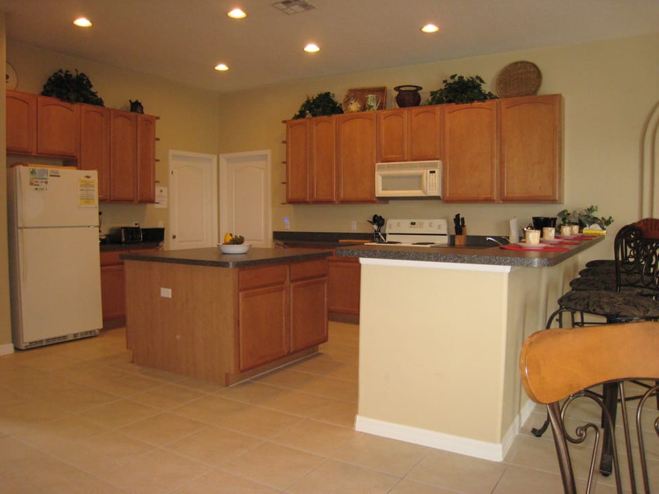 Huge 20x16 fully equipped kitchen, breakfast bar seating and an attached nook.