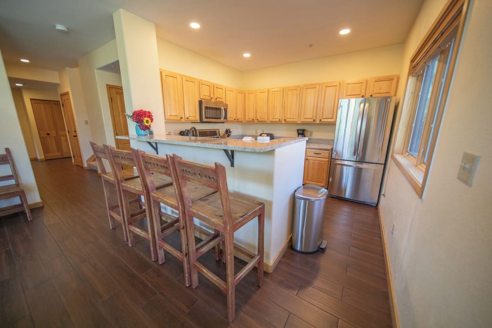 Barstool seating that overlooks the kitchen