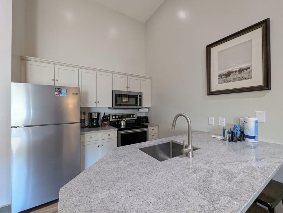 Your fully equipped kitchen features granite countertops, stainless steel appliances, and everything you need to prepare delicious meals during your stay.