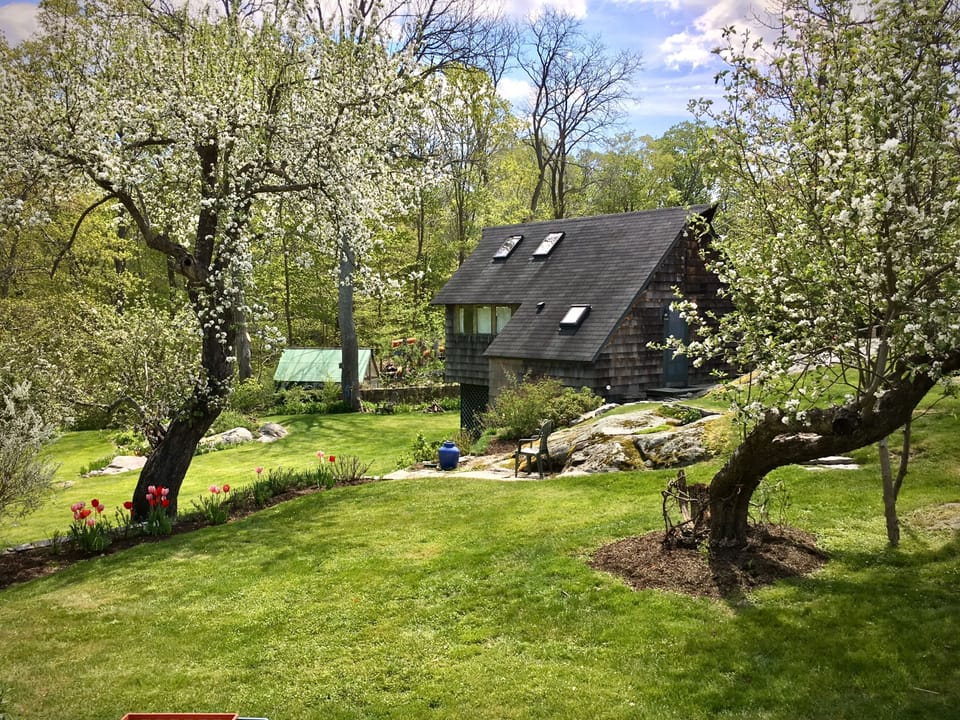 View of Cottage and lovingly landscaped property.