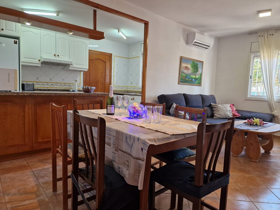 All in one place: The combined living and dining area with an open kitchen at House Angeles creates a sociable atmosphere for the whole family.