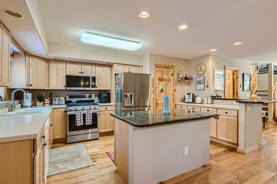 Gourmet Kitchen stocked with everything you need and center island to gather