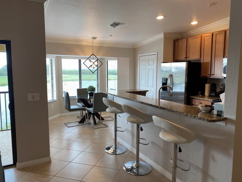 The breakfast nook provides a view of the 8th hole and the pond.