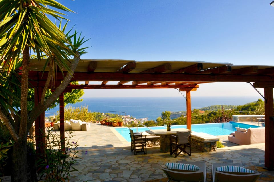 The shady pergola with seating .incredible views onto the port of Patitiri