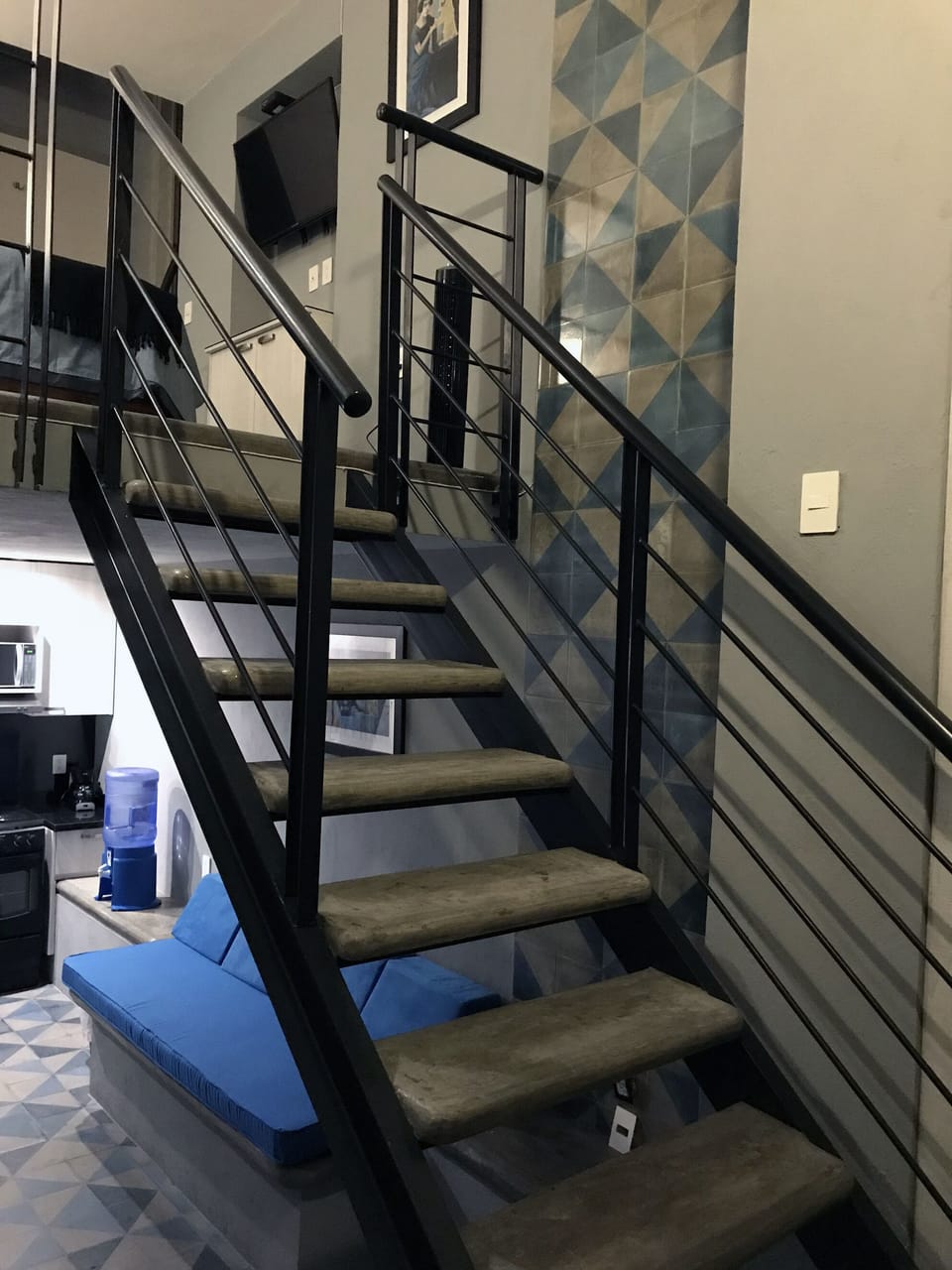 Open stairs from entry to loft bedroom