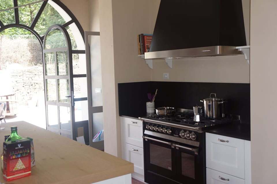 Double oven stove. Doors through to courtyard. 