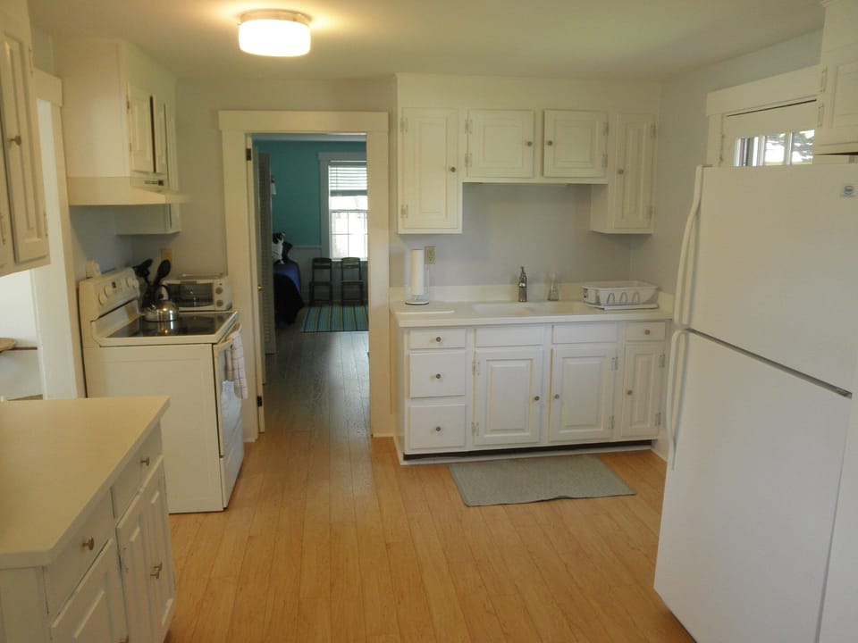 New Kitchen, new appliances, new countertops, and new wood floors throughout