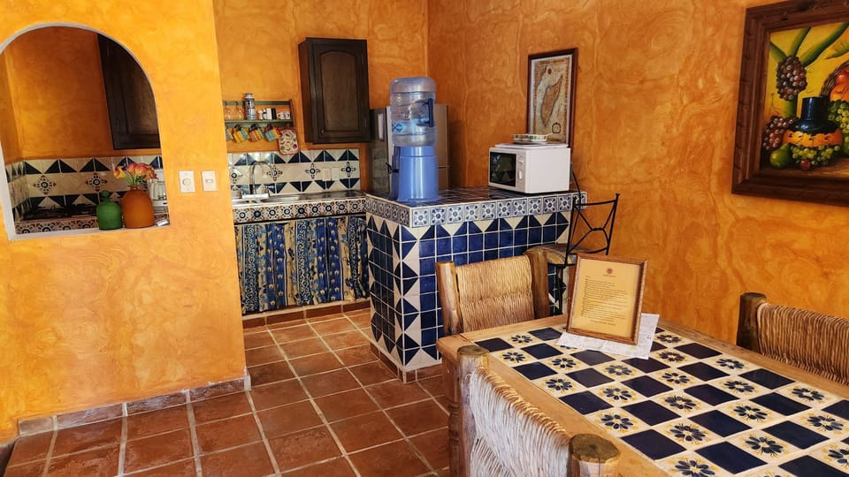 Partial view of dining room & kitchen.