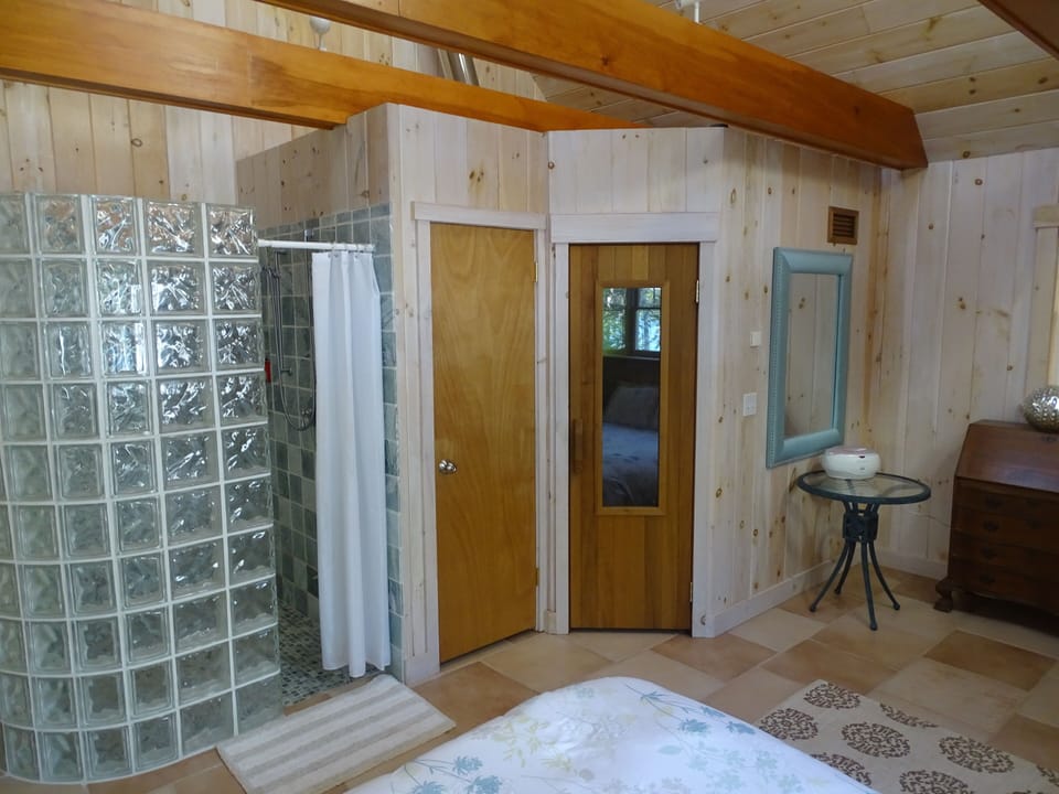 Walk in shower, toilet room, and wood fired sauna (left to right)