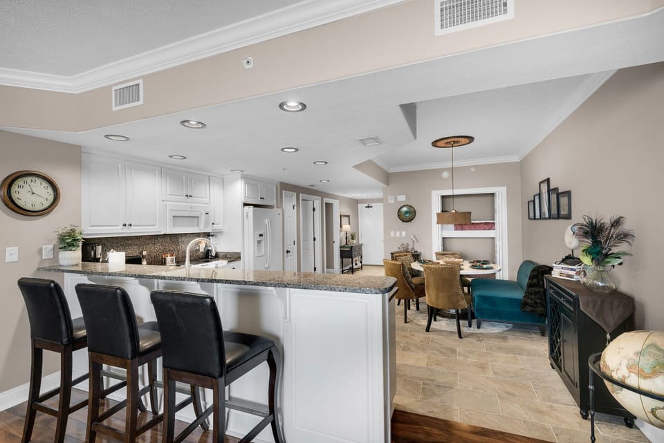 Vantage point from living area into kitchen and dining.