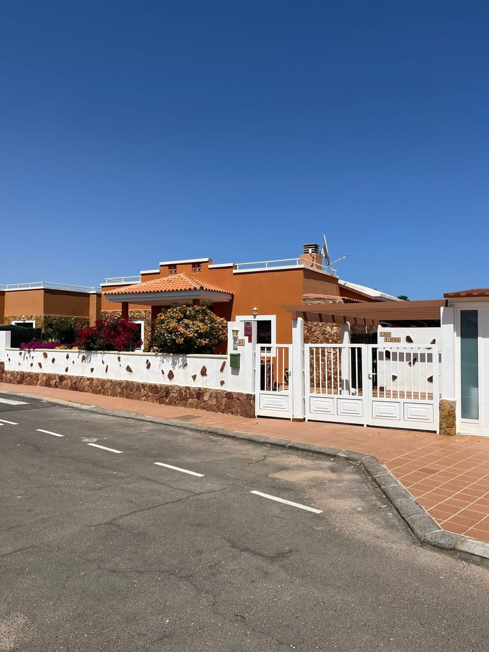 Front view, gates to private parking
