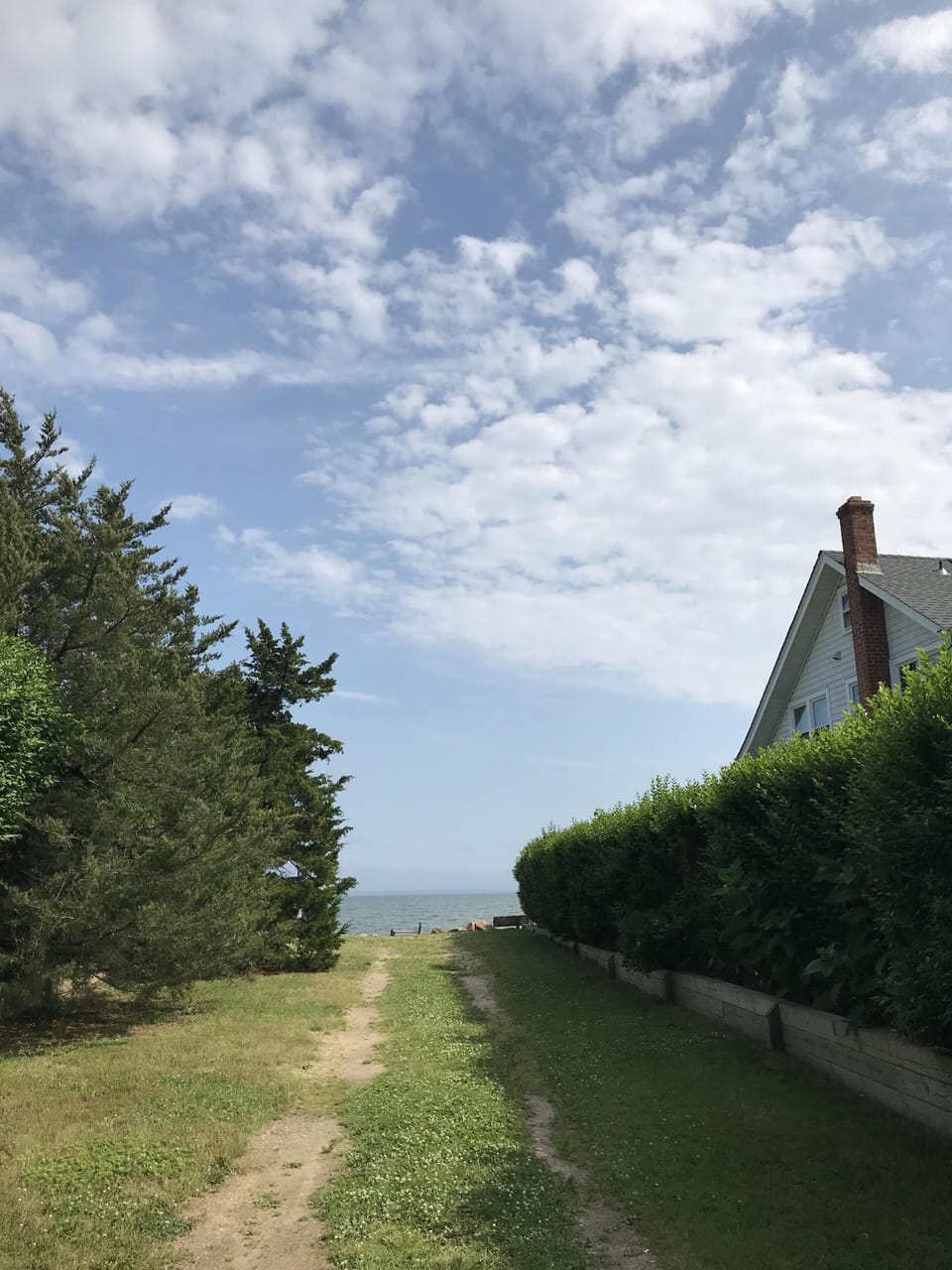 Walk to nearby private beach access.