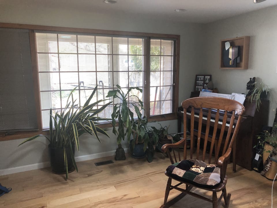 Living room with piano.
