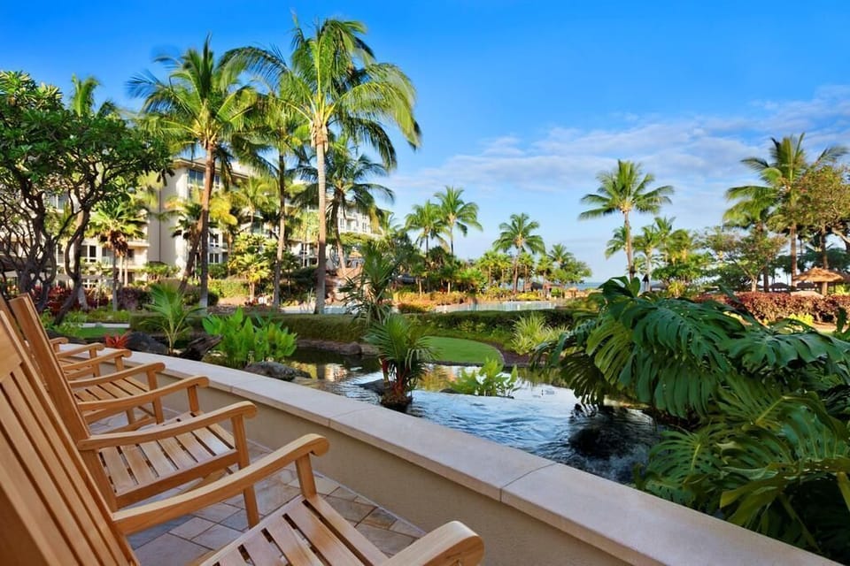Teak rocker over looking Koi pons and pool
