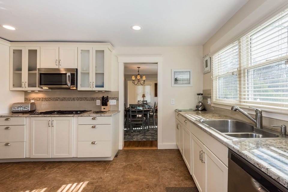Mordern kitchen with granite counter tops and Jenn Aire applicances.