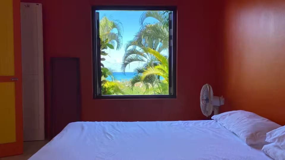 Orange bedroom with king size bed