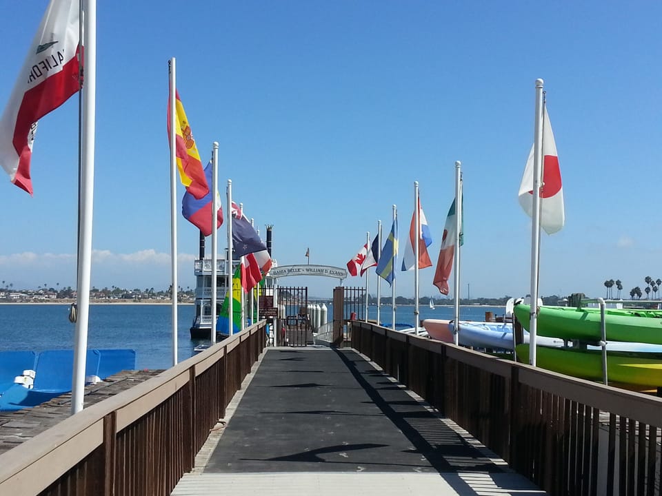 Walk down the boardwalk to see the pier and sports shack at the Catamaran Resor