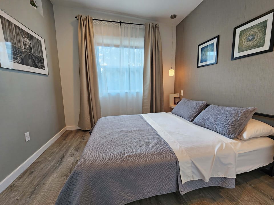 Window looking to the beautiful yard, with black-out curtains.
